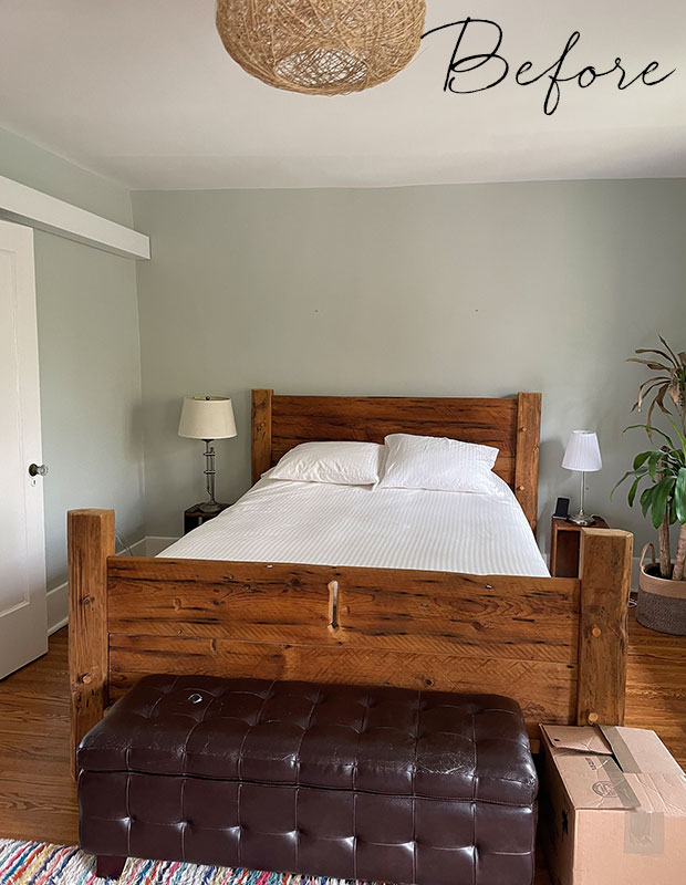 before: A basic bedroom set-up with a rustic wooden bed, grey walls, and a plant in the corner. little italy home renovation