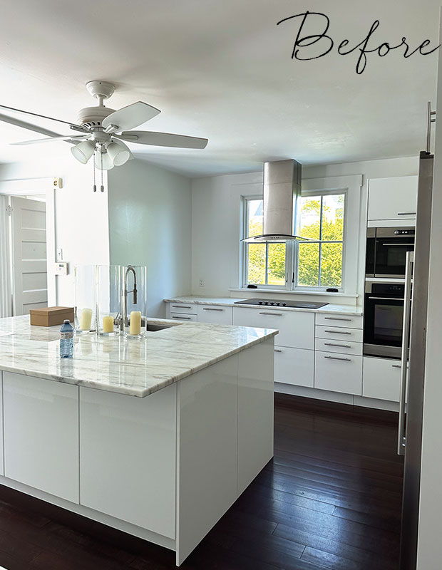 A before image featuring a bland white kitchen with basic marble counters and no decor or furniture. old nova scotia home