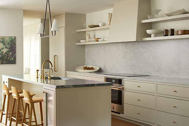 A white kitchen with smooth, cubic modern appliances and clean lines. serene city retreat
