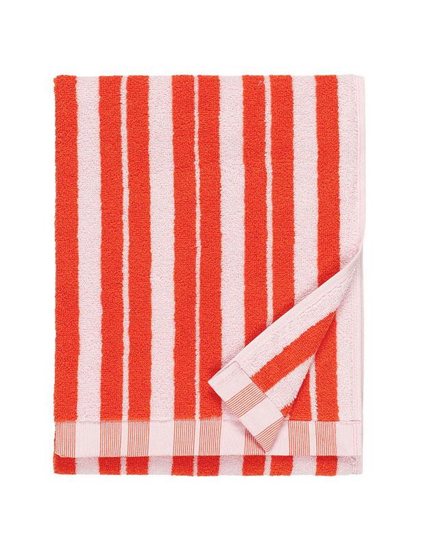 A bright red and light pink vertical striped towel. sustainable summer accents.