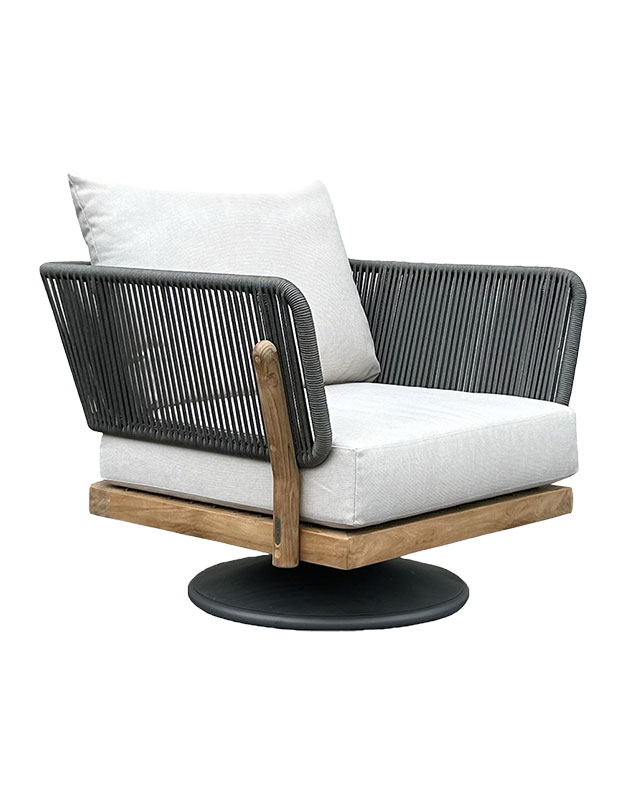 An outdoor swivel chair with light grey cushions and arm rests with black coords.