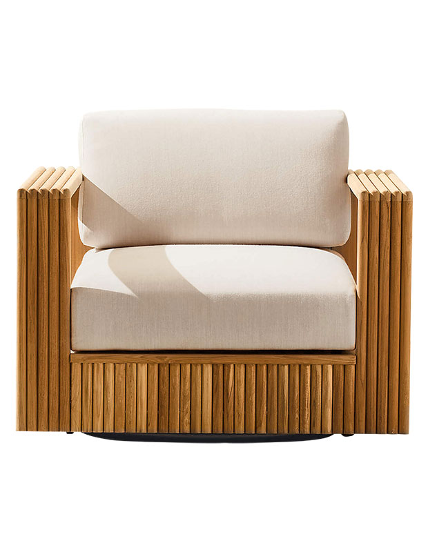 A teak slatted chair with cream coloured cushions.