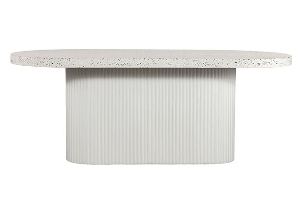 A stone table with reeded base and a speckled stone top.