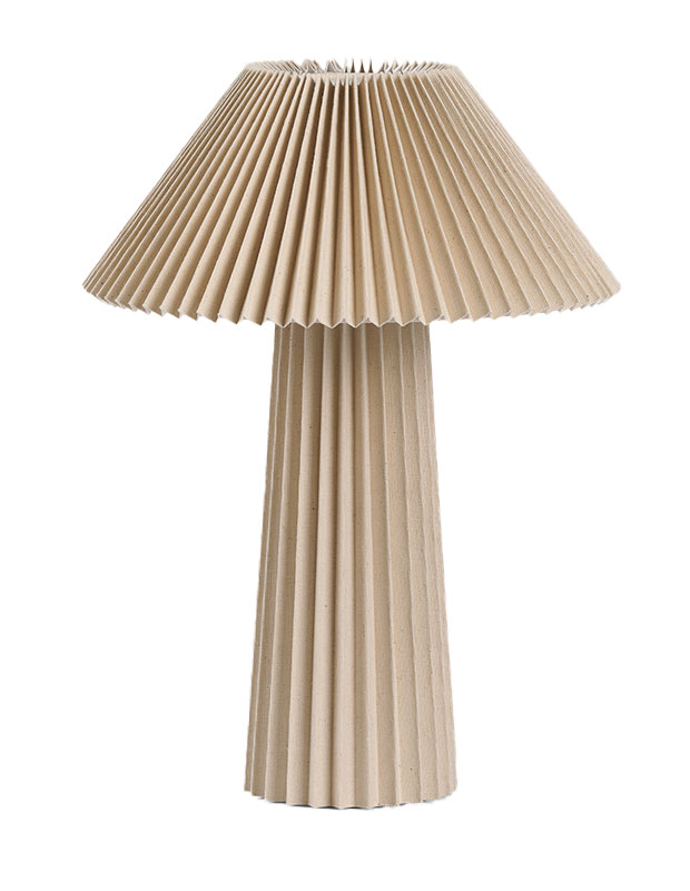 An image of a table lamp with all-around fluted texture on base and shade. calm stylish accents