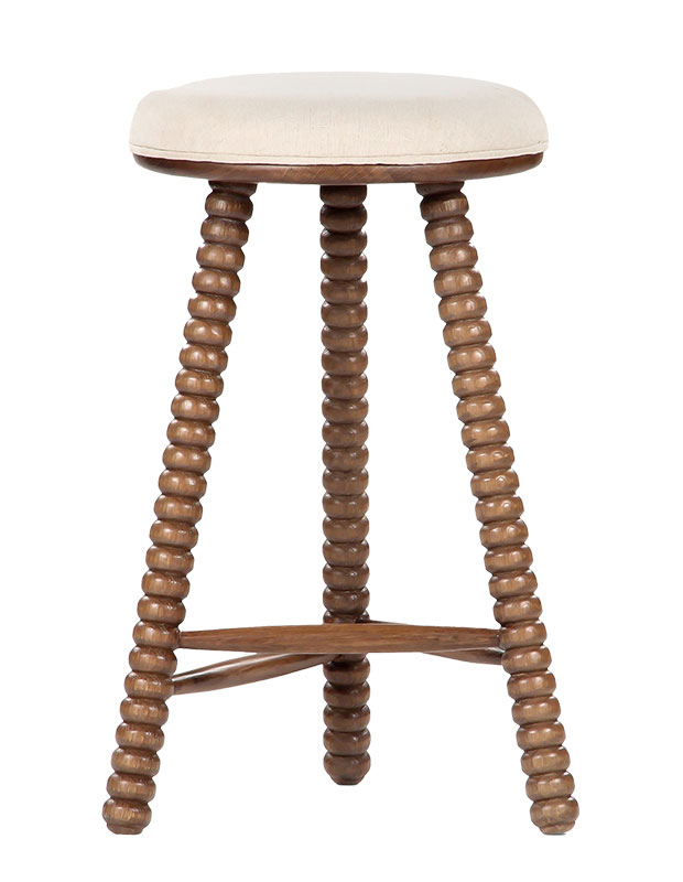 Calm, stylish accents: An image of a stool with bobbined legs.