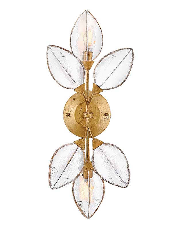 An image of a statement sconce made of brass and pressed glass. The centre is brass, from which three glass petals radiate upwards and three downwards.