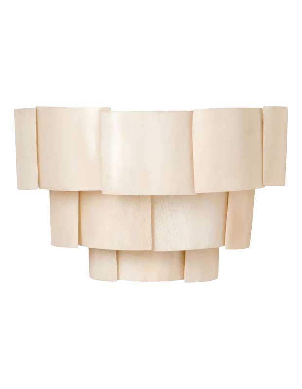 A photo of a statement sconce made of three layers of white, square banana leaves.