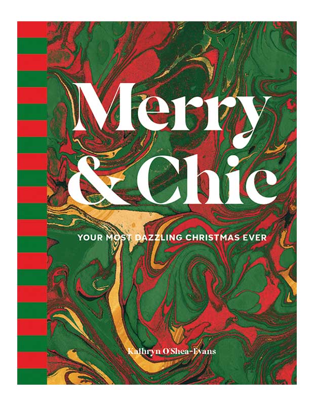 The cover of design book "Merry and Chic." It features the title in large white letters over a background of marbled paper in red and green.