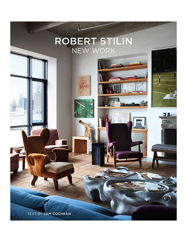 The cover of the design book "Robert Stilin: New Work," which is a picture of a living room with two modern wingback chairs in front of a window looking out over a body of water with the title in the top centre in plain white letters.