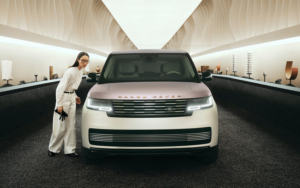 A woman stands beside the Range Rover Milan Design Week Pearl of Tay model.