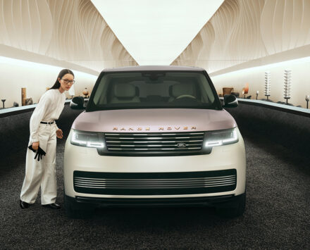 A woman stands beside the Range Rover Milan Design Week Pearl of Tay model.